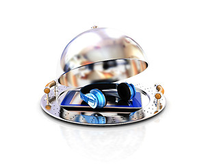 Image showing Phone and headphones on glossy salver dish under a cover 