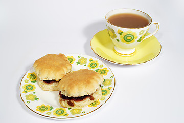 Image showing Two scones and a drink