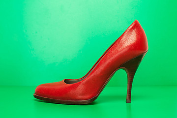 Image showing single red high heels