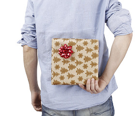 Image showing Young man holding a present