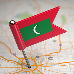 Image showing Maldives Small Flag on a Map Background.