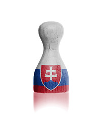 Image showing Wooden pawn with a flag painting