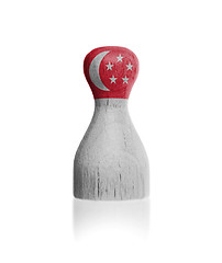 Image showing Wooden pawn with a flag painting