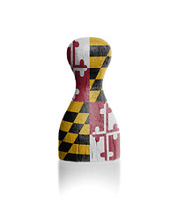 Image showing Wooden pawn with a flag painting