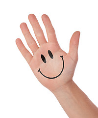 Image showing Hand with smiley isolated on white, concept of communication