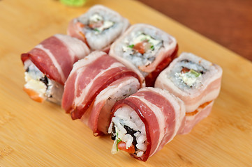 Image showing Sushi roll with bacon