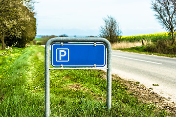 Image showing Blue parking sign in nature