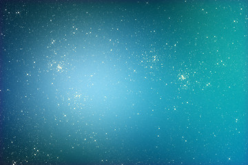 Image showing Starry glitter background with stars on blue color