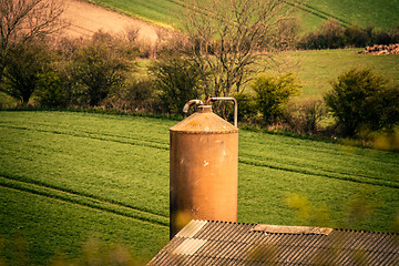 Image showing Silo storage with a field in the background