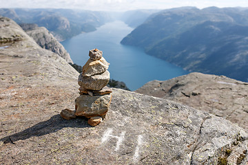 Image showing Stack of rocks with mountain and fjord view