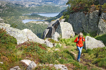 Image showing Woman with backpack hiking