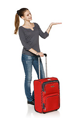 Image showing Young casual girl in full length with suitcase