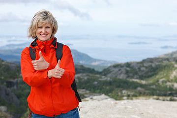 Image showing Happy woman gesturing thumbs up