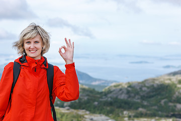 Image showing Happy woman gesturing thumbs up