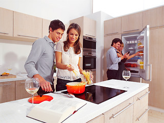 Image showing Friends Preparing spaghetti