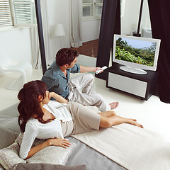 Image showing couple watching television