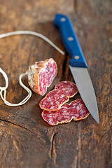 Image showing italian salame pressato pressed slicing