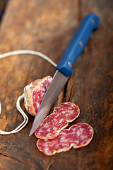 Image showing italian salame pressato pressed slicing