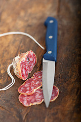 Image showing italian salame pressato pressed slicing