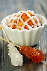 Image showing Cupcake with icing, stick with white and brown sugar.