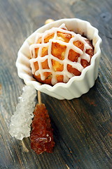 Image showing Cupcake with icing and sugar sticks.