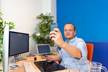 Image showing Business man taking a selfie.