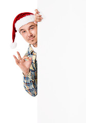 Image showing Young man in Santa hat