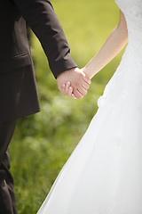 Image showing Hands of a bride and groom