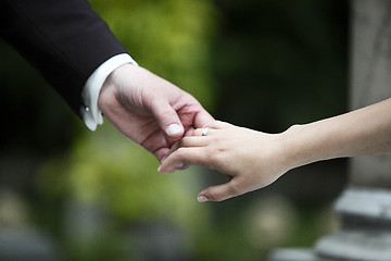 Image showing Hands of a bride and groom