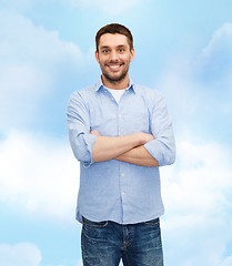 Image showing smiling man with crossed arms