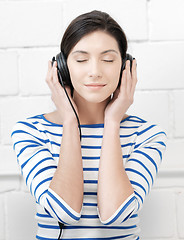 Image showing happy teenage girl in big headphones