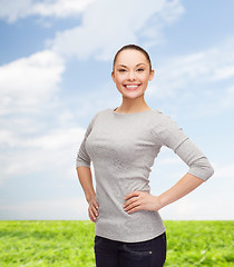 Image showing smiling asian woman over white background