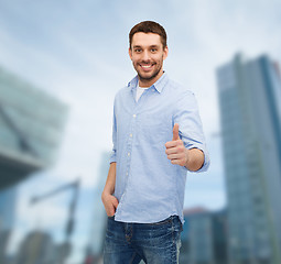 Image showing smiling man showing thumbs up