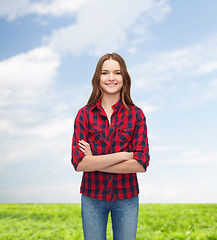 Image showing smiling young woman in casual clothes