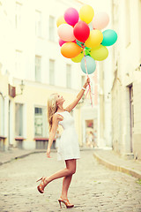 Image showing woman with colorful balloons