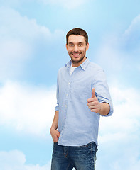 Image showing smiling man showing thumbs up