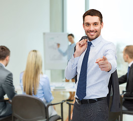 Image showing handsome buisnessman with jacket over shoulder