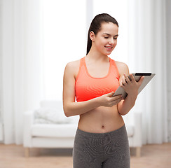 Image showing sporty woman with tablet pc computer