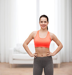 Image showing smiling teenage girl in sportswear