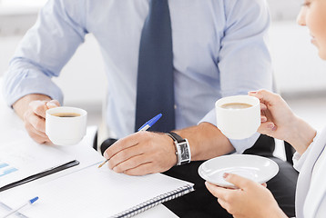 Image showing man and woman discussing something in office