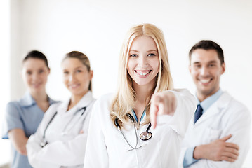 Image showing female doctor in front of medical group