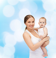 Image showing happy mother with adorable baby