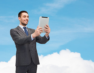 Image showing smiling businessman with tablet pc computer