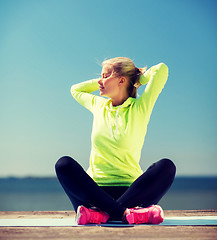 Image showing woman doing yoga outdoors