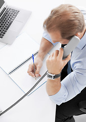 Image showing handsome businessman talking on the phone