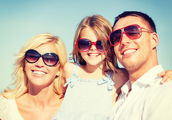 Image showing happy family with blue sky