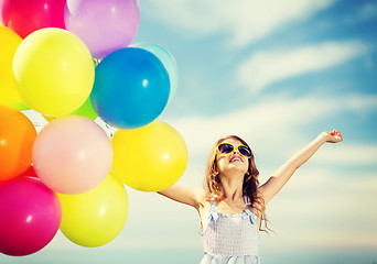 Image showing happy girl with colorful balloons