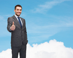 Image showing handsome businessman showing thumbs up