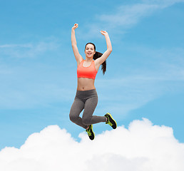 Image showing sporty teenage girl jumping in sportswear