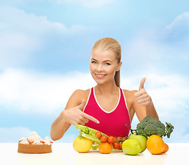 Image showing woman pointing at healthy food